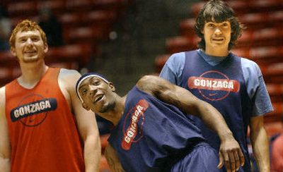 Gonzaga forward David Pendergraft, left, clowning around at the end of Wednesday's practice with Erroll Knight and Adam Morrison, takes credit for goading Morrison into growing the famous mustache. Now Pendergraft has started his own little facial project. 
 (Brian Plonka / The Spokesman-Review)