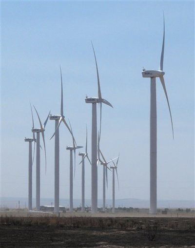 Wind turbines owned by Chicago-based Exelon Corp. turn on Thursday, Aug. 2, 2012 near Mountain Home, Idaho. Idaho is in the midst of a fight between utilities and wind developers. (AP / John Miller)