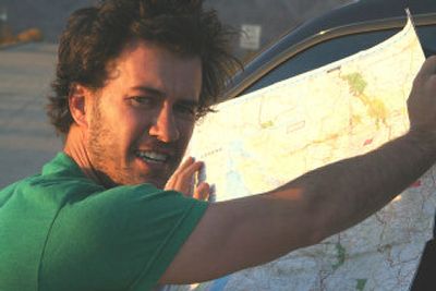 
Blake Mycoskie checks a Washington state map as he nears the final leg of a three-month tour of the country.
 (courtesy of TOMS shoes / The Spokesman-Review)