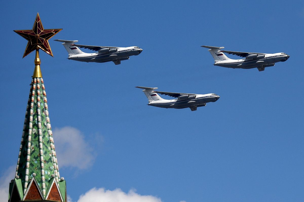 Ilyushin Il-76 transport planes perform a flyover above Red Square during the Victory Day military parade marking the 75th anniversary of the victory in World War II, on June 24, 2020, in Moscow.  (Handout)