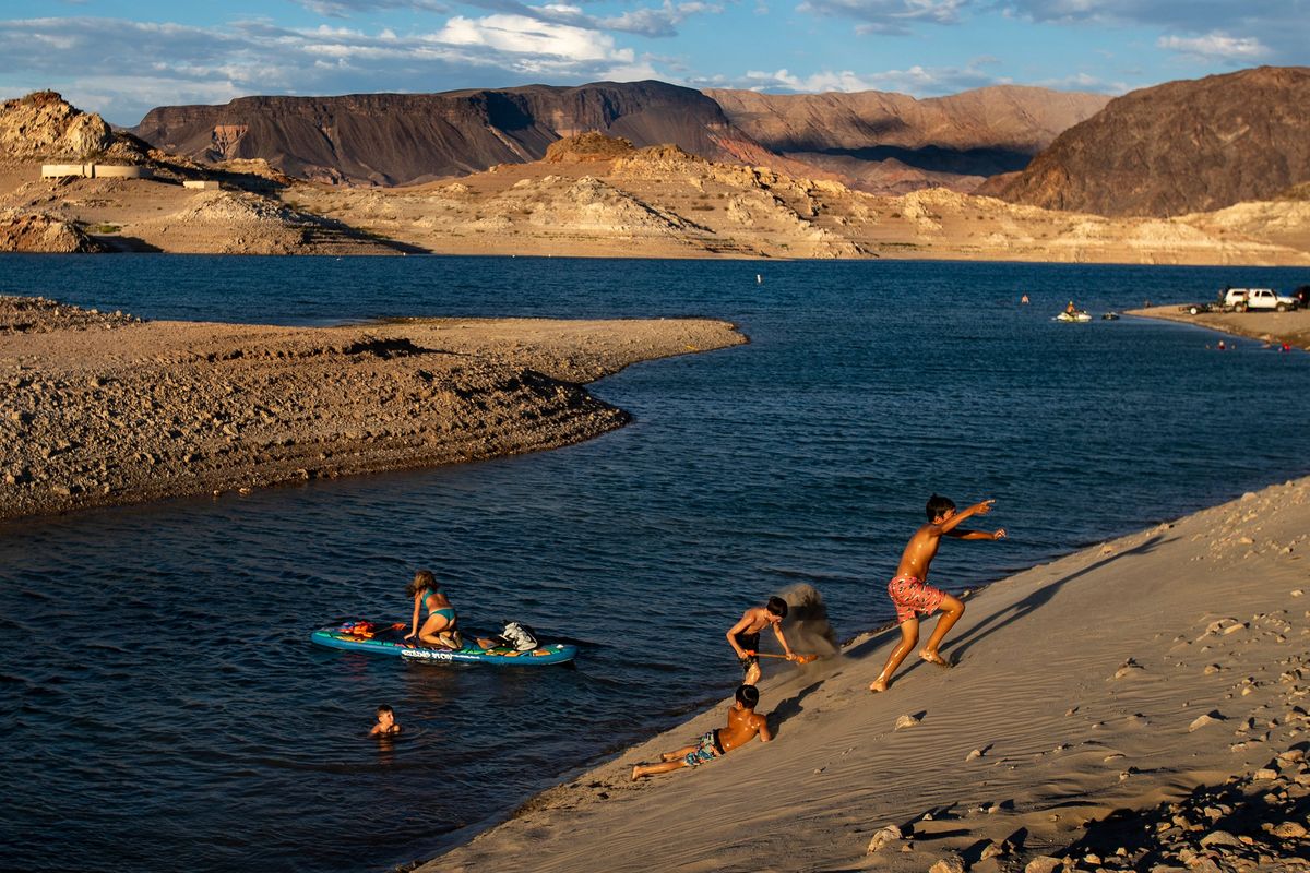 Children frolic along Boulder Beach on drought-stricken Lake Mead in Las Vegas in July 2022.  (Gina Ferazzi/Los Angeles Times/TNS)