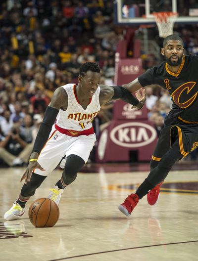 Atlanta Hawks’ Dennis Schroder, left, drives to the basket as Cleveland Cavaliers’ Kyrie Irving defends. Schroder scored 28 points in the Hawks’ 110-106 win in Cleveland on Tuesday, Nov. 8, 2016. (Phil Long / Associated Press)