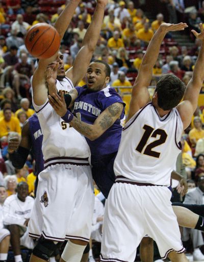 Venoy Overton and the Huskies earned a split in Arizona.  (Associated Press / The Spokesman-Review)