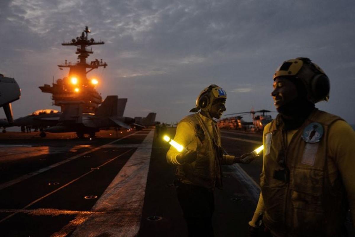 Aboard the USS George Washington, young sailors adjust to war with