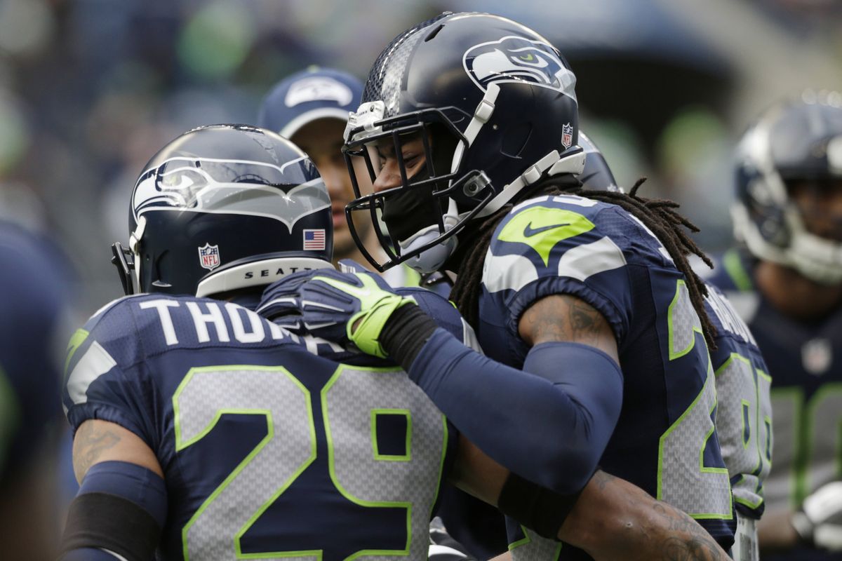 Seahawks defensive backs Earl Thomas, left, and Richard Sherman, who were both named first-team NFL All-Pro selections on Friday ( Story, page C4) lead Seattle’s top-ranked defense into the postseason. (Associated Press)