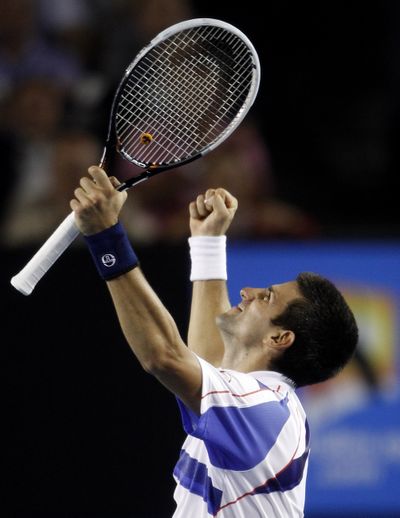 Novak Djokovic celebrates his victory over Roger Federer in Aussie semis. (Associated Press)