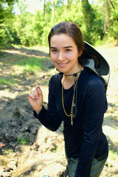 Micherre Fox, from New York, holds a 2.3-carat uncut white diamond she dug up at Arkansas’ Crater of Diamonds State Park. After three weeks, with bug bites and tattered hiking boots, Fox found the stone.  (Arkansas State Parks)