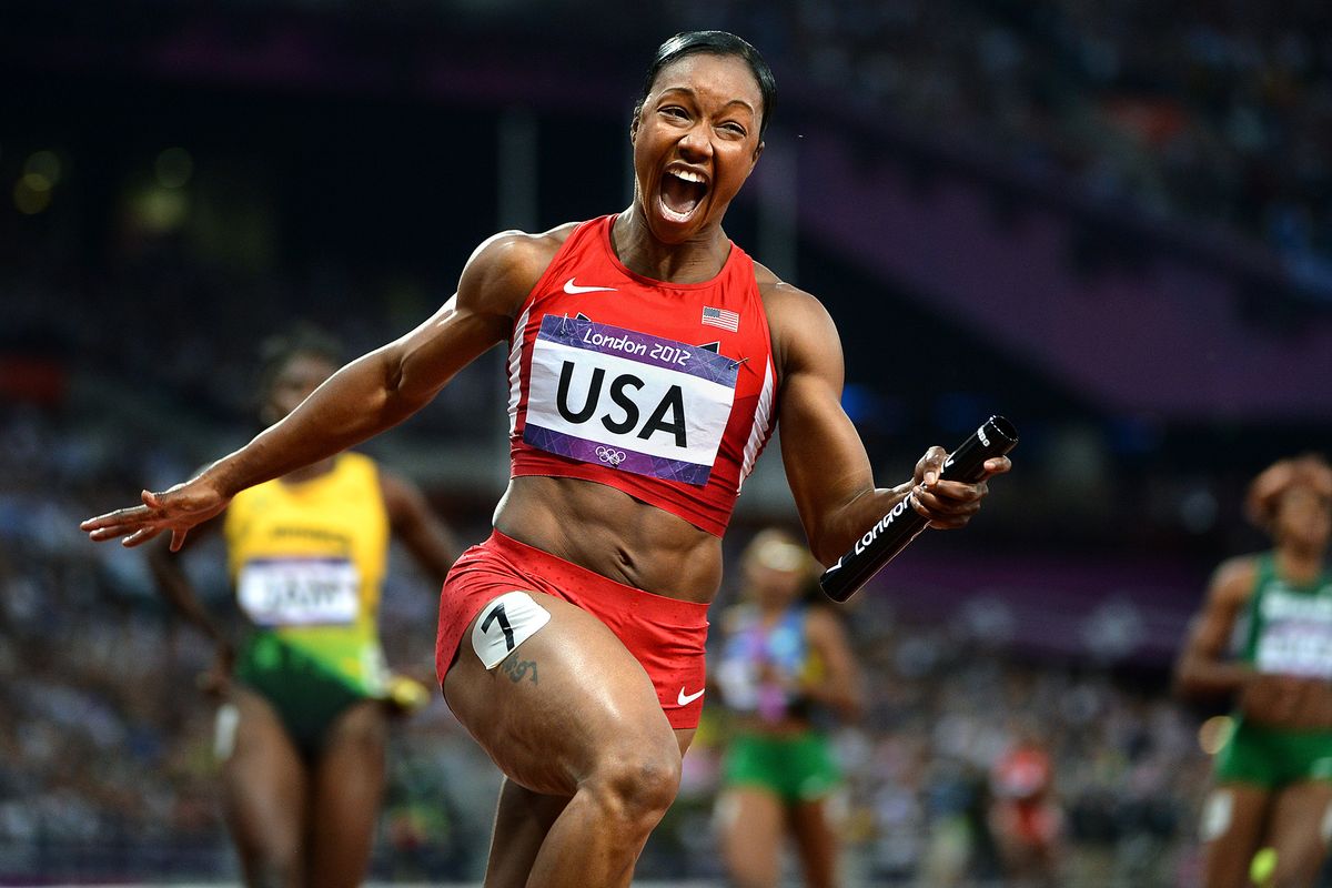 U.S. sprinter Carmelita Jeter screams Friday while clinching the gold medal in the women’s 4x100 relay in world-record time.