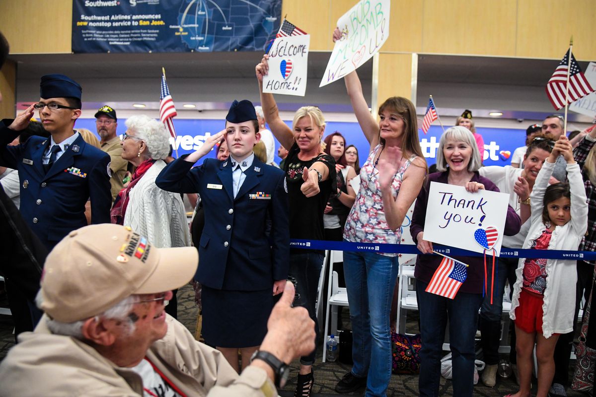 Patrick Breen give a thumbs up to supporters waiting for Inland Northwest Honor Flight veterans, Tuesday, May 8, 2018, at Spokane International Airport. (Dan Pelle / The Spokesman-Review)