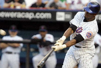 
Mets' Jose Reyes follows through on homer on his way to hitting for the cycle. 
 (Associated Press / The Spokesman-Review)