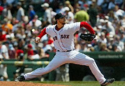 
Boston's Josh Beckett pitches during the third inning of Wednesday's shutout. 
 (Associated Press / The Spokesman-Review)