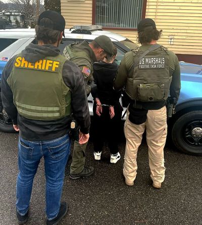 Law enforcement officers arrest 32-year-old Briana M. Smutz Wednesday in Millwood after detectives say her 2-year-old daughter accessed Smutz’s fentanyl and overdosed two years ago near Loon Lake. The toddler survived.  (Courtesy of U.S. Marshals Service)