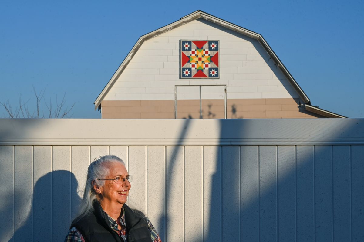 Every time Denise Adams looked at her neighbor’s barn, she imagined it with a brightly-colored barn quilt. A barn quilt is not made of fabric. The quilt design is painted on wood and attached to the side of the barn. Eventually, Adams met the barn owners and they loved the idea. The 48-by-48-inch barn quilt was installed in September in Spokane Valley.  (DAN PELLE/THE SPOKESMAN-REVIEW)