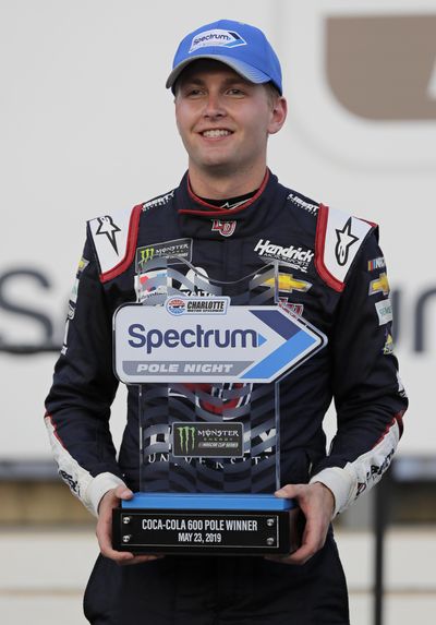 William Byron poses with the trophy in Victory Lane after winning the pole position during qualifying for Sunday’s NASCAR Cup Series auto race at Charlotte Motor Speedway in Concord, N.C., Thursday, May 23, 2019. (Chuck Burton / Associated Press)