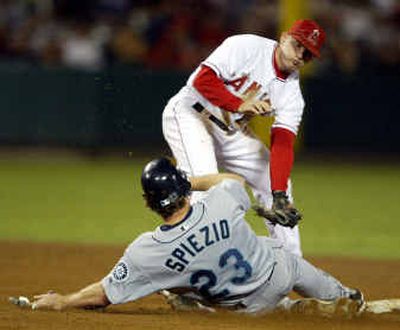 
Scott Spiezio of the Seattle Mariners steals second base in the fifth inning as an overthrow from the catcher eludes Anaheim shortstop David Eckstein. 
 (Associated Press / The Spokesman-Review)