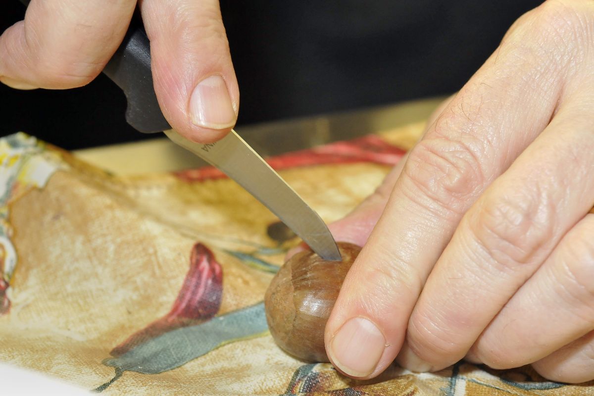 Cassano’s Carl Naccarato makes an “X” in a raw chestnut