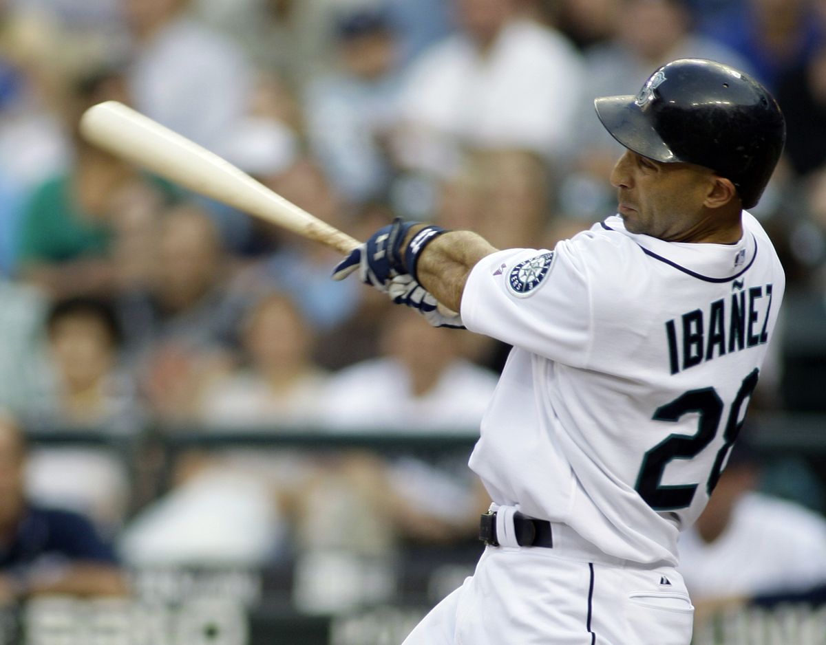 Raul Ibanez connects for a three-run home run during Seattle’s third inning.  (Associated Press / The Spokesman-Review)