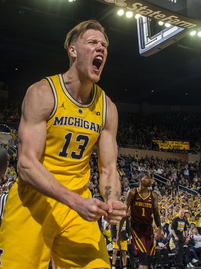 Michigan forward Ignas Brazdeikis (13) reacts to earning a free throw after making a basket in the second half of an NCAA college basketball game against Minnesota at Crisler Center in Ann Arbor, Mich., Tuesday, Jan. 22, 2019. Michigan won 59-57. (Tony Ding / Associated Press)
