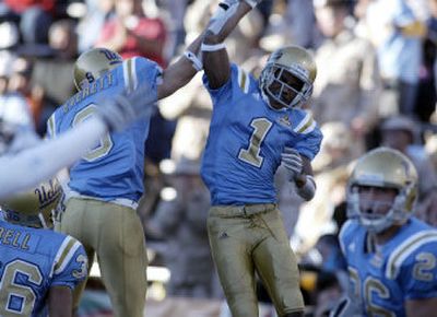 
UCLA's Brandon Breazell (1) celebrates the first of two onside kick returns for touchdowns in a wild fourth quarter in the Sun Bowl. 
 (Associated Press / The Spokesman-Review)