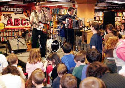 
They Might Be Giants John Flansburgh, left, and John Linnell perform a free concert for children at Borders Books & Music in Ann Arbor, Mich., as part a promotional tour for their new album 