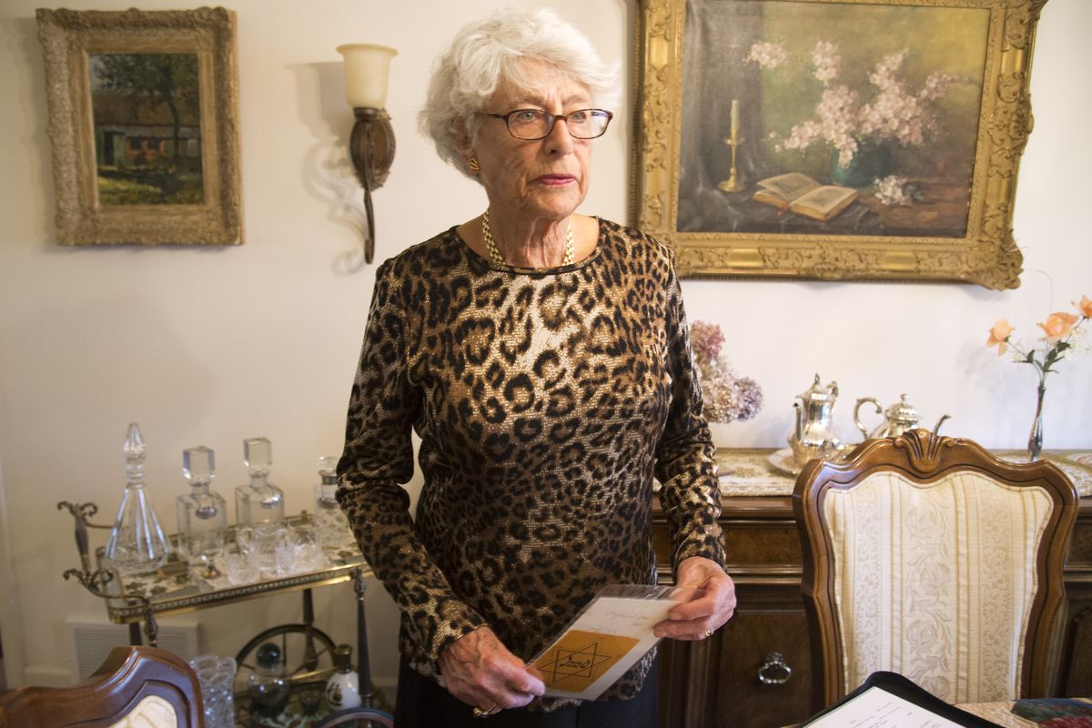 Carla Peperzak, 91, holds a yellow cloth star Holland’s Jews were forced to wear under Nazi rule during World War II. Jews were required to buy the stars – at about 15 cents, the cost of two loaves of bread – and stitch them on their coats under threat of arrest. (Jesse Tinsley)