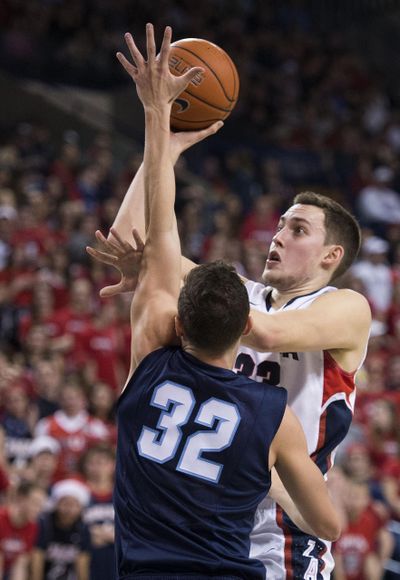 Gonzaga forward Kyle Wiltjer (33) takes a shot over San Diego forward Brett Bailey (32) in the first half of an NCAA men's college basketball game, Thursday, Feb. 26, 2015, in the McCarthey Athletic Center. COLIN MULVANY colinm@spokesman.com (Colin Mulvany / The Spokesman-Review)