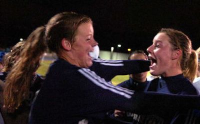 
Sarah Dean, left, and Tara Cronin celebrate after Gonzaga Prep defeated University for the District 8 4A soccer championship. 
 (Jed Conklin / The Spokesman-Review)