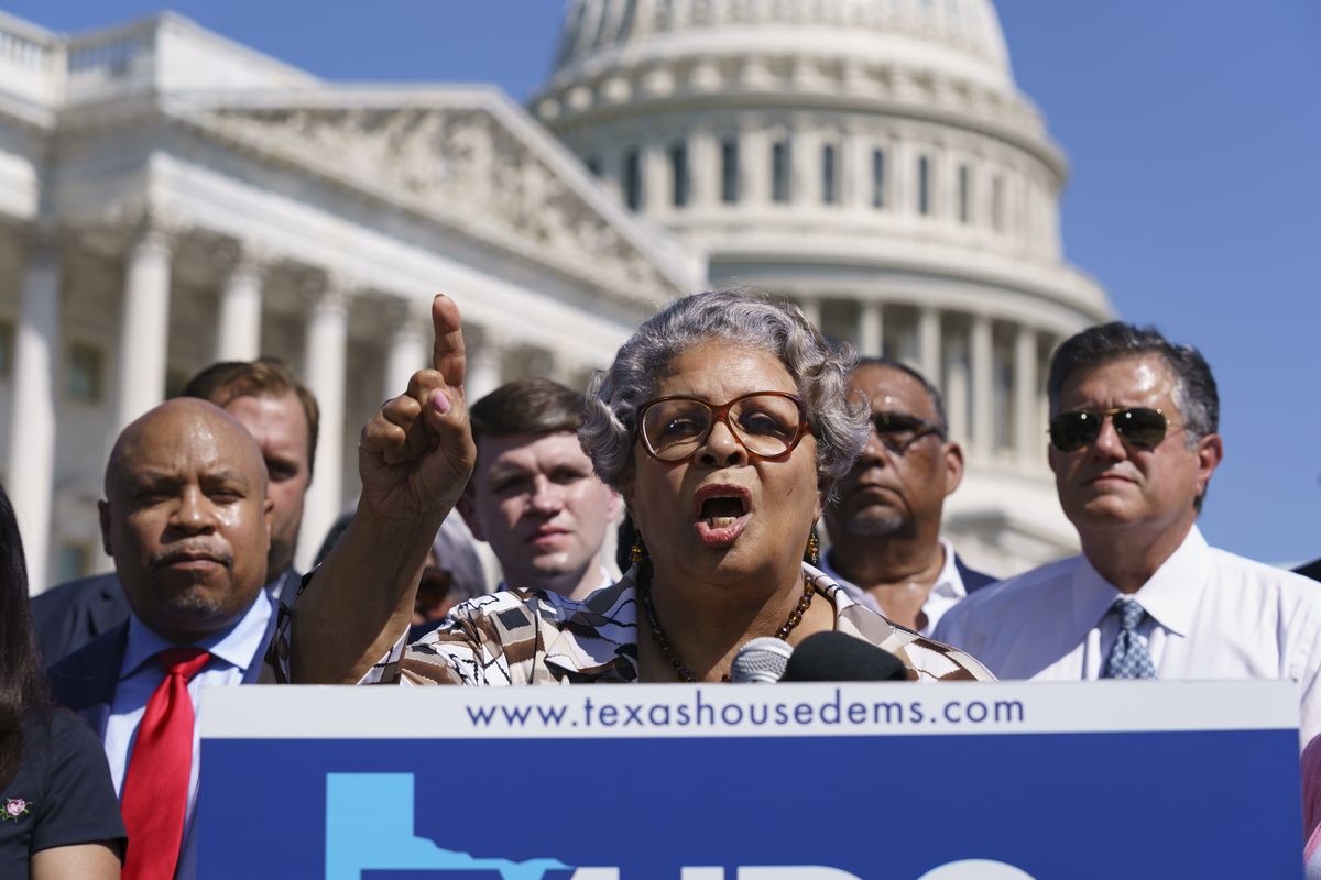 In this July 13, 2021 photo, Texas State Rep. Senfronia Thompson, dean of the Texas House of Representatives, speaks as Democratic members of the Texas legislature hold a news conference at the Capitol in Washington. Texas Democrats are starting a second week of holing up in Washington to block new voting laws back home. More than 50 Democrats in the Texas House of Representatives had plans Monday to continue on a media blitz in the nation's capital and pressure Congress to act on federal voting rights.  (J. Scott Applewhite)