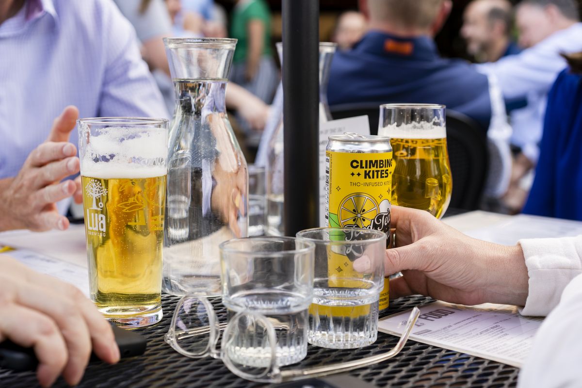 At Lua in Des Moines, Iowa, patrons consume Climbing Kites hemp drinks. Iowa last year enacted a law limiting the amount of THC in drink servings and cans. (KC McGinnis/For The Washington Post)