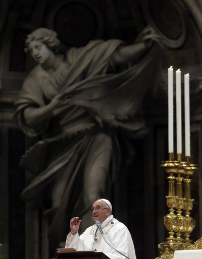 Pope Francis delivers his message Saturday as he celebrates an Easter vigil service, in St. Peter’s Basilica, at the Vatican. (Gregorio Borgia / AP)