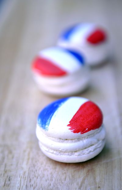 Celebrate Bastille Day by making your own French macarons, like these buttercream- and blueberry jam-filled cookies painted with food coloring made by Lynette Pflueger at Common Crumb in Spokane. (Adriana Janovich)