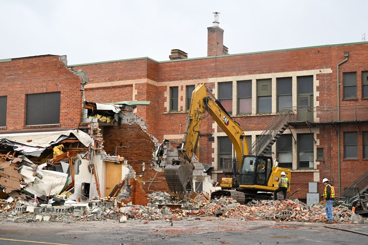 Workers from Rob’s Demolition raze Adams Elementary on Feb. 16 on Spokane’s South Hill. The school, dating back to 1909 and the oldest in the district, will be replaced with a new facility. (Jesse Tinsley/THE SPOKESMAN-REVIEW)