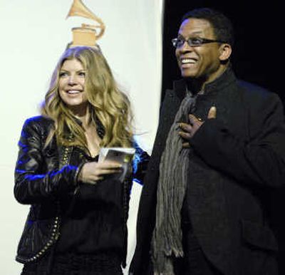
Herbie Hancock, right, reacts as Fergie looks on after being nominated for album of the year at the 50th annual Grammy Awards news conference Thursday.
 (The Spokesman-Review)