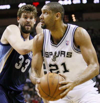 Tim Duncan, right, San Antonio Spurs have won at least 50 games in each of the last 12 NBA seasons, tying the 1980-91 Lakers for the longest such streak. (Associated Press)