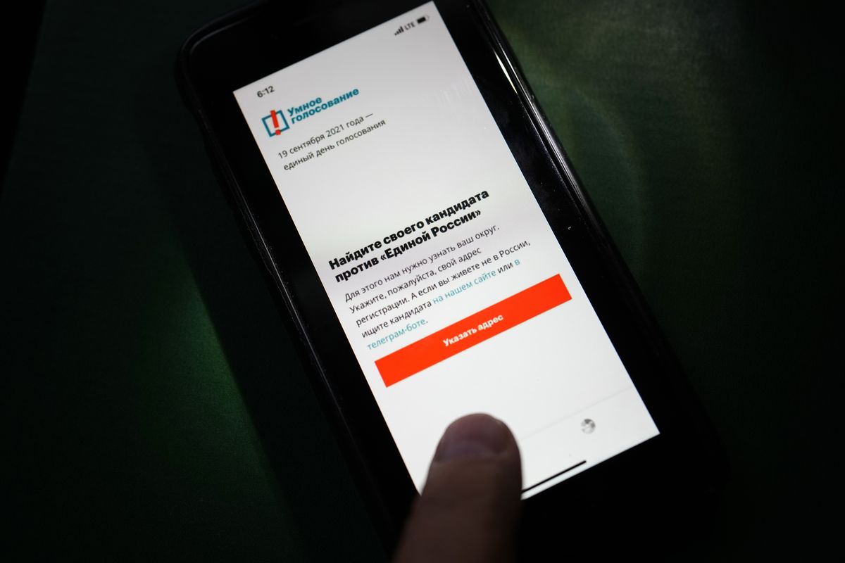 The app Smart Voting is displayed on an iPhone screen in Moscow, Russia, Friday, Sept. 17, 2021. Facing Kremlin pressure, Apple and Google on Friday removed from their online stores an opposition-created smartphone app that tells voters which candidates are likely to defeat those backed by Russian authorities, as polls opened in Russia
