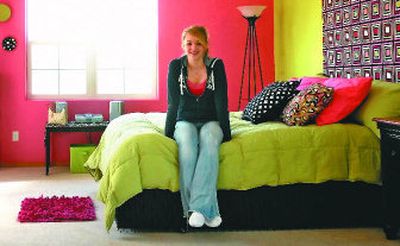 
Denel Lang sits in her new bedroom. Denel's mother, Renea, created the room in the extra space above the garage. 
 (Jed Conklin / The Spokesman-Review)