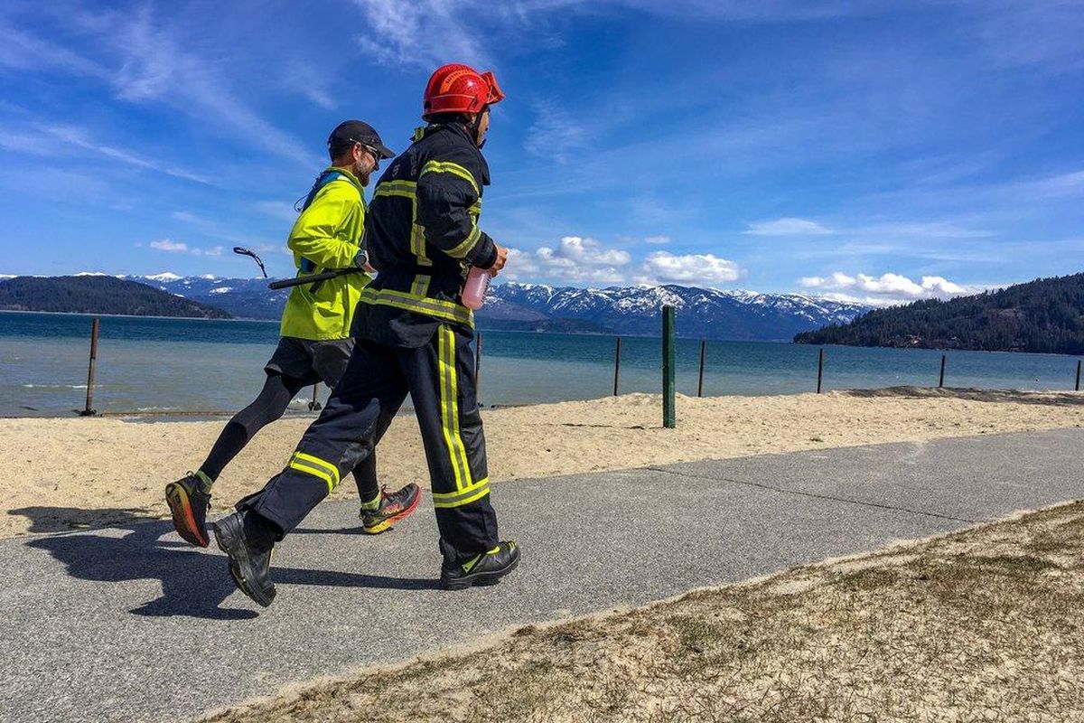 Erik Olson and Gwen LeTutour​ train near Sandpoint. LeTutour will run a 100 miles in full firefighting gear to raise money for cancer prevention. (Plant Positive / Courtesy)