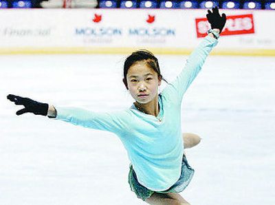 
Californian Caroline Zhang worked out on the Arena ice Saturday afternoon in preparation for tonight's short program. 
 (Dan Pelle / The Spokesman-Review)