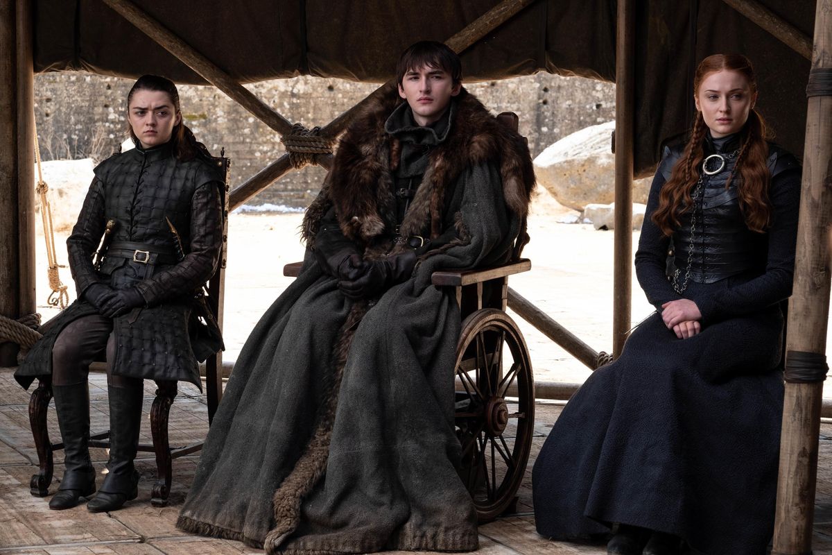 This image released by HBO shows from left to right Maisie Williams (Arya Stark), Isaac Hempstead Wright (Bran Stark) and Sophie Turner (Sansa Stark) in a scene from the final episode of "Game of Thrones," that aired Sunday, May 19, 2019. (HBO)