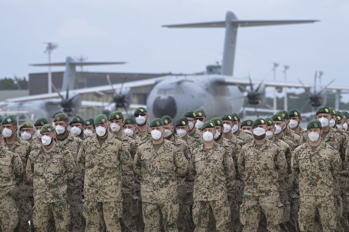 Soldiers of the German Armed Forces have lined up in front of the Airbus A400M transport aircraft of the German Air Force for the final roll call in Wunstorf, Germany, Wednesdat, June 390, 2021. The last soldiers of the German Afghanistan mission have arrived at the air base in Lower Saxony. The mission had ended the previous evening after almost 20 years. The soldiers had been flown out with four military planes from the field camp in Masar-i-Sharif in the north of Afghanistan.  (Hauke-Christian Dittrich)