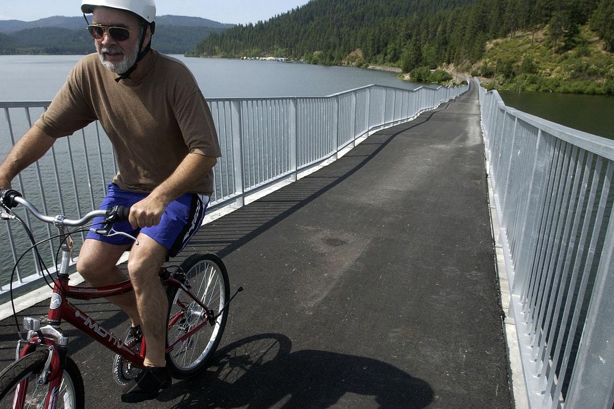 Henry Mayer rides up the trestle over Lake Coeur d’Alene near Heyburn State Park in 2005. The trestle is a highlight of the 72-mile Trail of the Coeur d’Alenes, which is envisioned as part of a continent-spanning trail. (Jesse Tinsley / The Spokesman-Review)