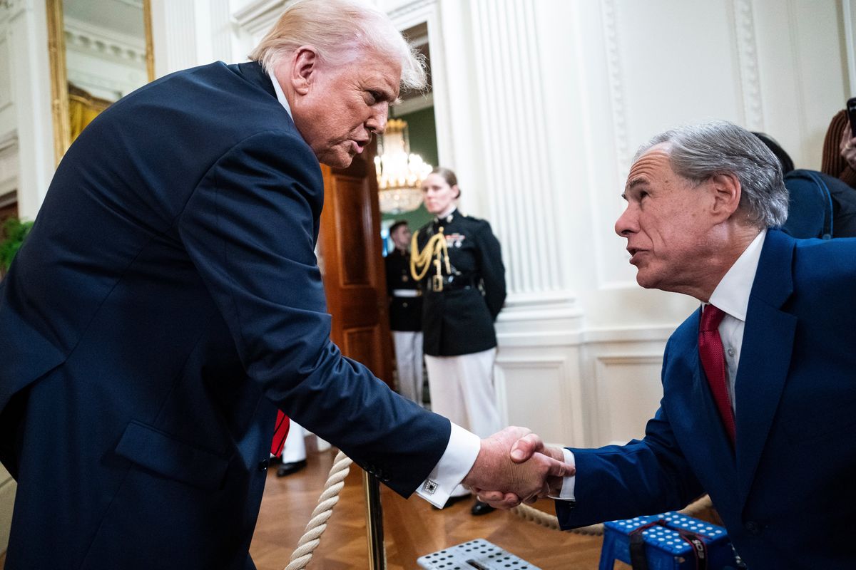 President Donald Trump greets Texas Gov. Greg Abbott at the White House on March 20. (Jabin Botsford/The Washington Post)