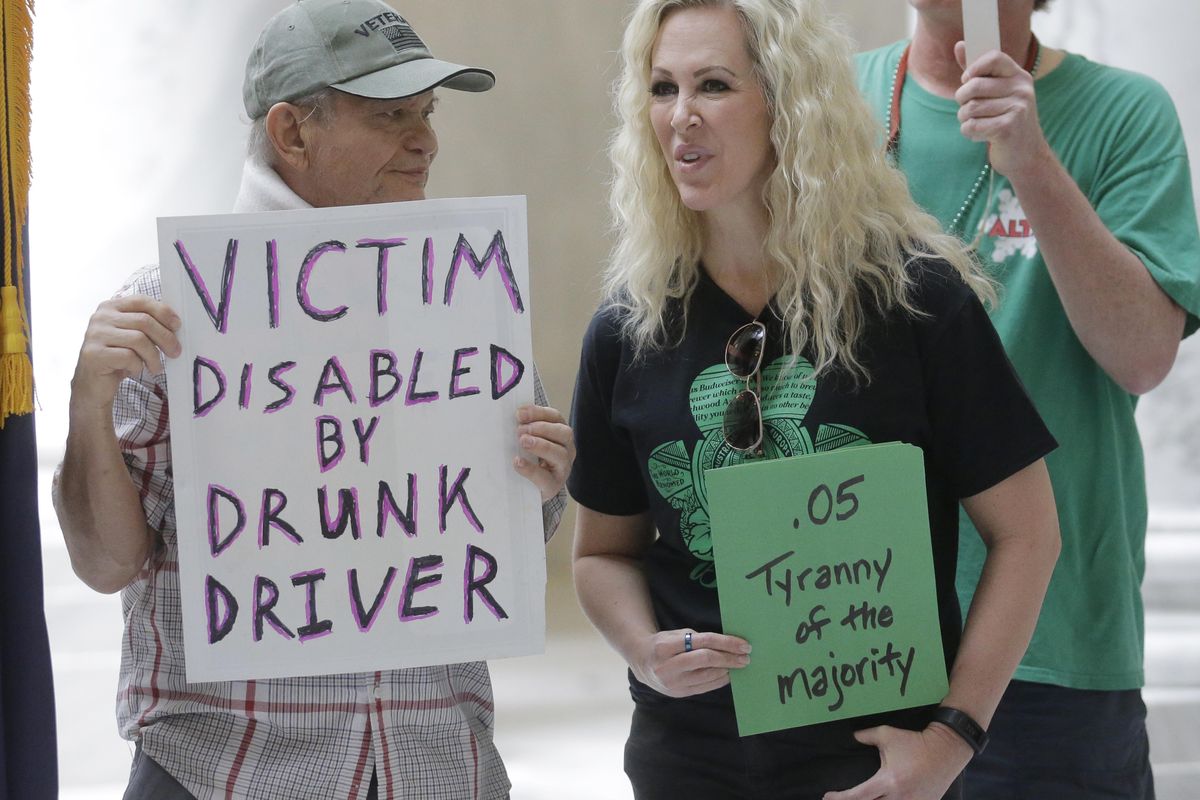 Ed Staley, left, and Tali Bruce, right, attend a rally concerning the DUI threshold March 17, 2017, at the Utah state Capitol in Salt Lake City. The United States’ lowest DUI threshold takes effect this weekend in Utah. Lawmakers in the state approved the 0.05 percent blood-alcohol limit in 2017, and Gov. Gary Herbert signed it into law. The change goes into effect Saturday, Dec. 29, 2018. (Rick Bowmer / AP)