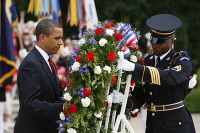 President Barack Obama lays a wreath at the Tomb of the Unknowns on Monday at Arlington National Cemetery.  (Associated Press / The Spokesman-Review)