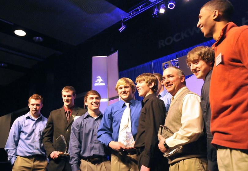 Coeur d’Alene’s football team gathers for photos at Wednesday’s banquet. Coach Shawn Amos, third from right, was Junior Male Coach of the Year, and Chad Chalich, second from left, was Junior Male Athlete of the Year. (Jesse Tinsley)