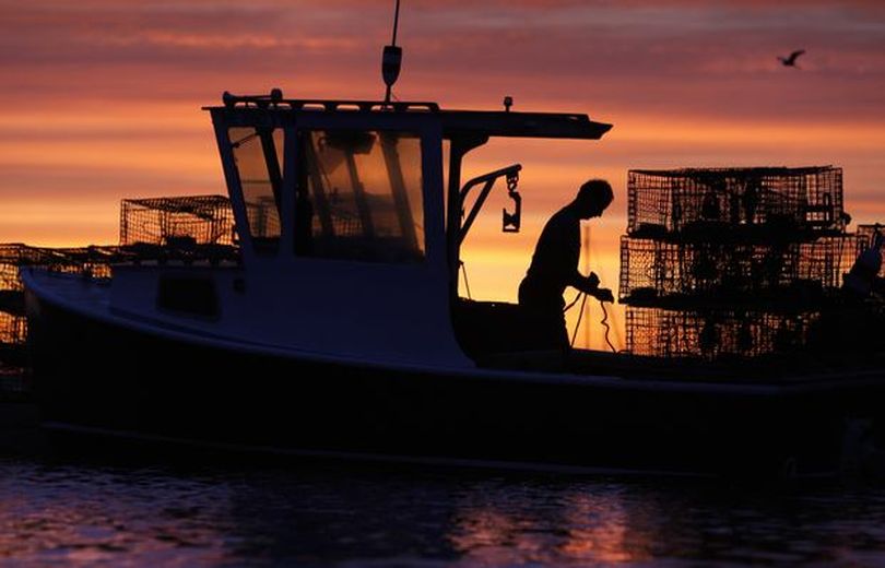 June 18, 2009
AP Photo/Robert F. Bukaty

A red sky at dawn is a signal to mariners that the weather is changing for the worse, prompting lobsterman Bruce Steeves of Raymond, Maine, to get an early start as he readies his traps, Thursday, in Portland, Maine. Rain is expected to dominate the weather for the next two days. 