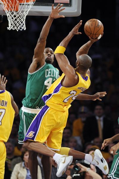 Lakers guard Kobe Bryant shoots over Tony Allen of the Celtics in the first half of Thursday’s game. Bryant scored 30 points, giving him 12 30-point games this postseason.   (Associated Press)