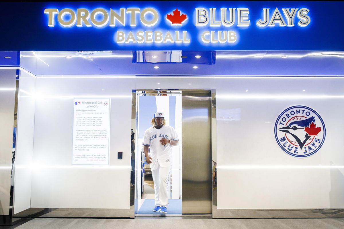 Toronto Blue Jays rookie Vladimir Guerrero Jr. walks out of the clubhouse to speak at a news conference before his major league debut against the Oakland Athletics in a baseball game Toronto, Friday April 26, 2019. (Mark Blinch / Canadian Press via AP)