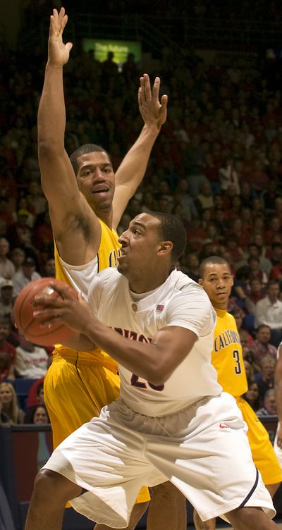 Arizona’s Derrick Williams goes to the basket against Cal’s Jamal Boykin during the first half. (Associated Press)