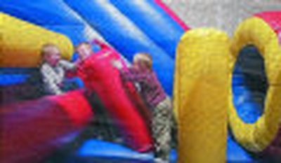 
Boys can be boys at Jump and Bounce in Spokane Valley.
 (The Spokesman-Review)